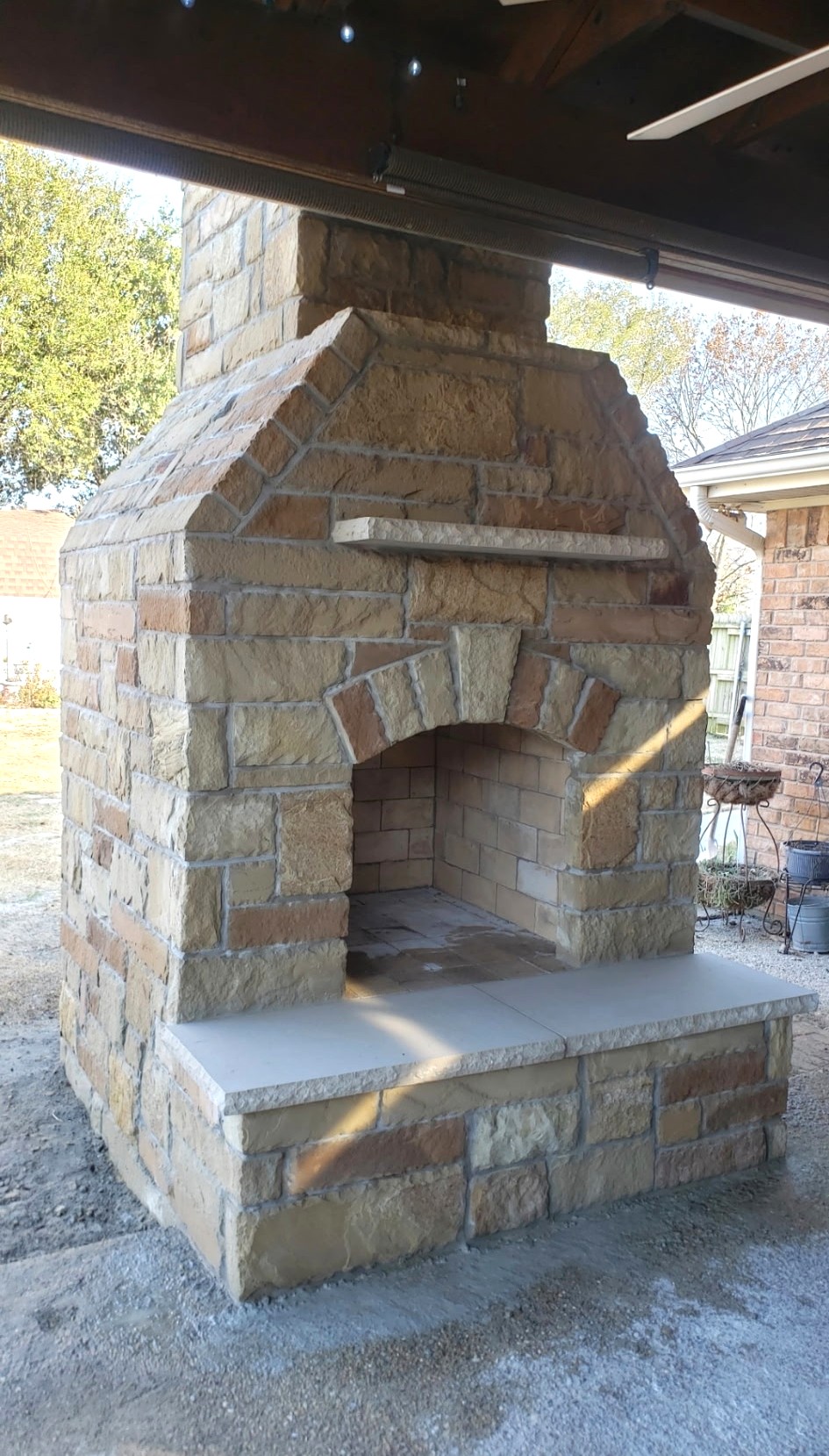 Outdoor fireplace build by Fowler Custom Exteriors