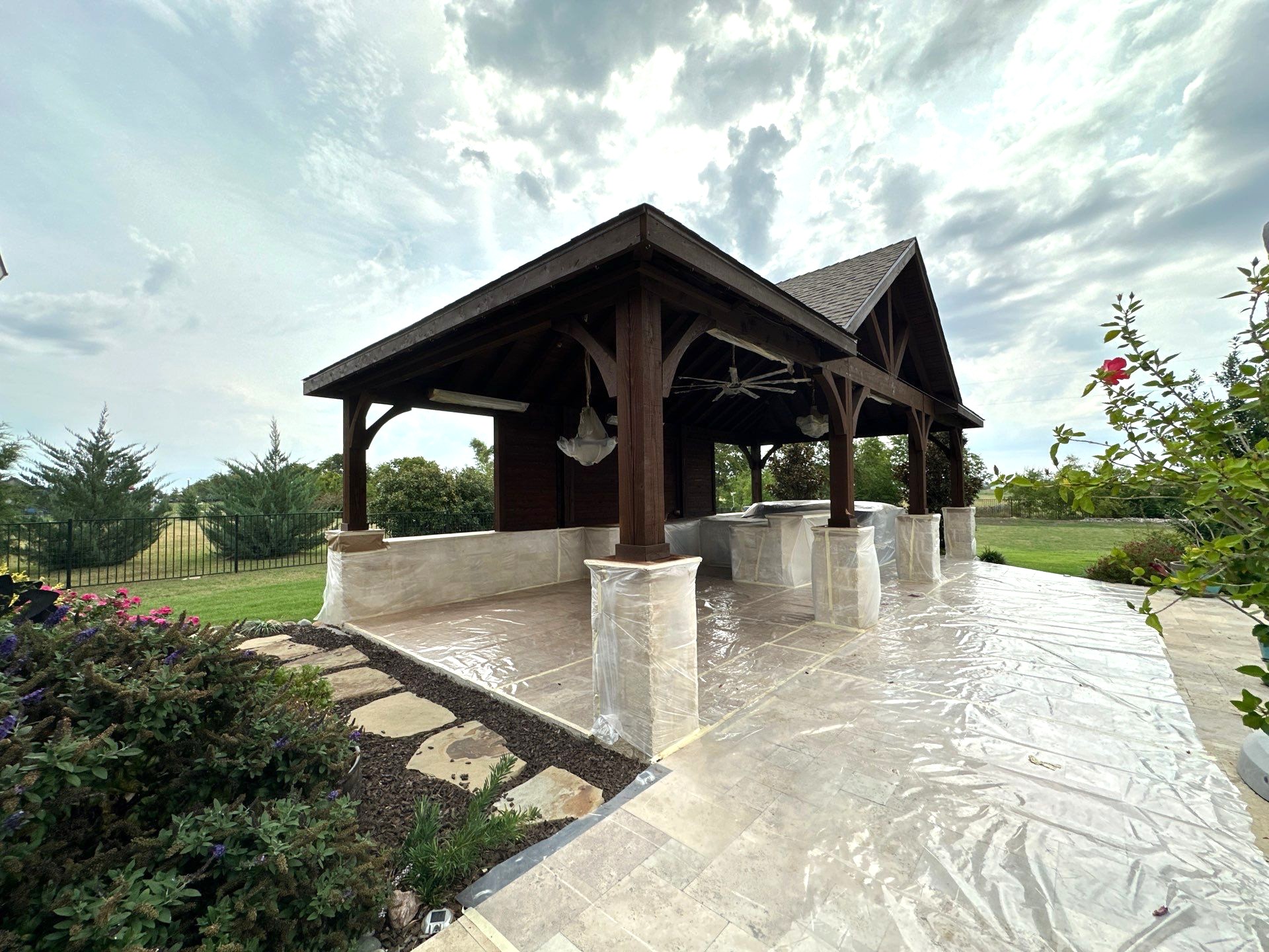 Covered outdoor kitchen and patio by Fowler Custom Exteriors